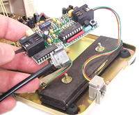 The Super Tiny Dialer without the case, in the phone
