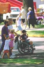 Click to see bigger picture of a family with a boy on oxygen